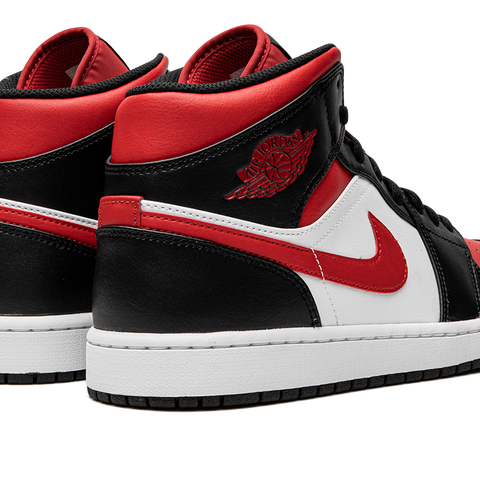 Air jordan 1 mid bred toe sales